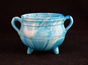 Sowerby glass blue malachite, two handled cauldron on three feet