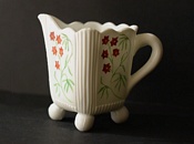 Sowerby glass opal white, cream jug decorated with flowers, flowers picked out in red, mustard and green enamel
